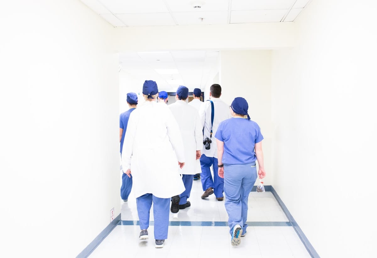 Medical team walking through a hospital corridor, representing the coordinated care available for severe burn injuries