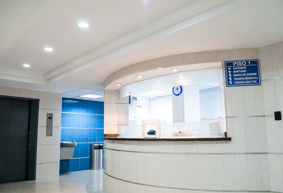 Modern diagnostic imaging room with technician at console, equipped for rapid X-ray assessment of broken arm fractures