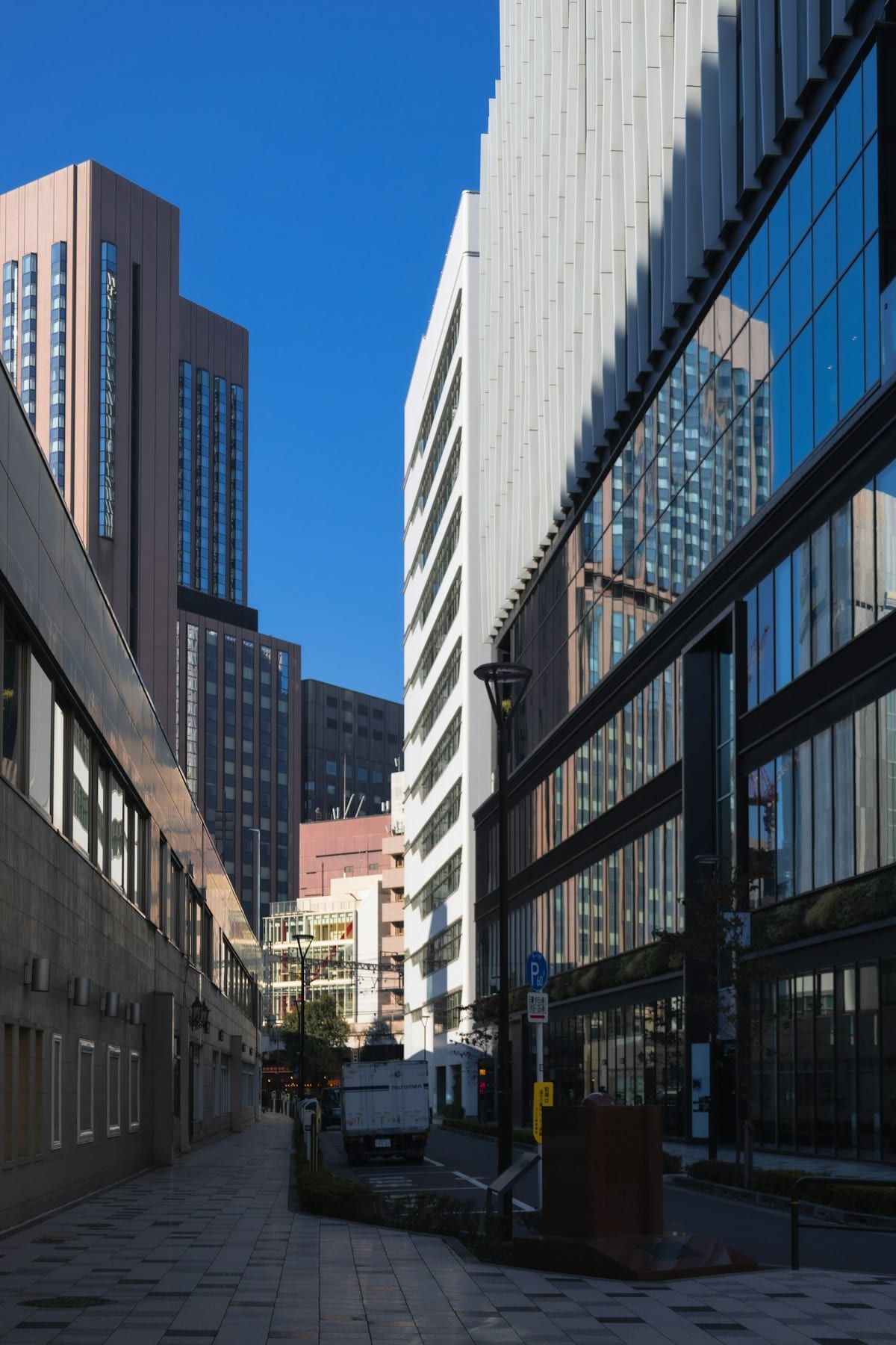 Modern high-rise buildings along a city street, representing the commercial growth in the Alliance, TX area
